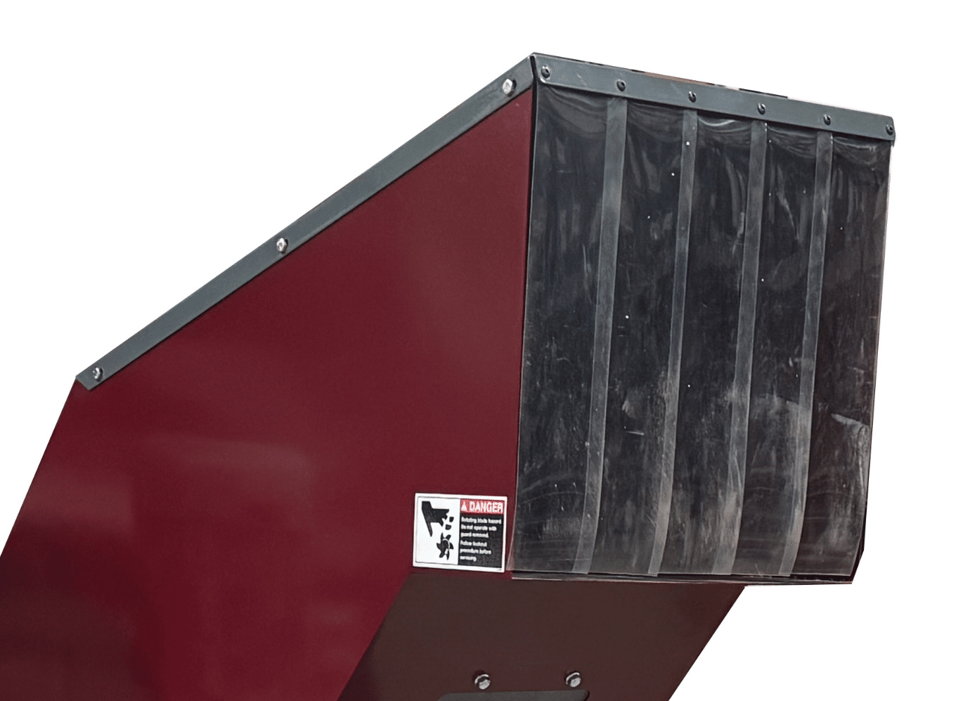 A close-up of a red industrial machine, designed for processing styrofoam, with black rubber flaps at the opening and a safety warning label on the side—an excellent example of the precision engineering found in Better Densifiers.