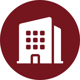 White building icon with square windows and a door, set against a maroon circular background—perfectly representing PolyWiz’s commitment to Better Densifiers in urban spaces.