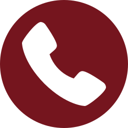 White telephone handset icon tilted right, centered on a solid maroon circular background, representing support for styrofoam recycling and information about Better Densifiers.